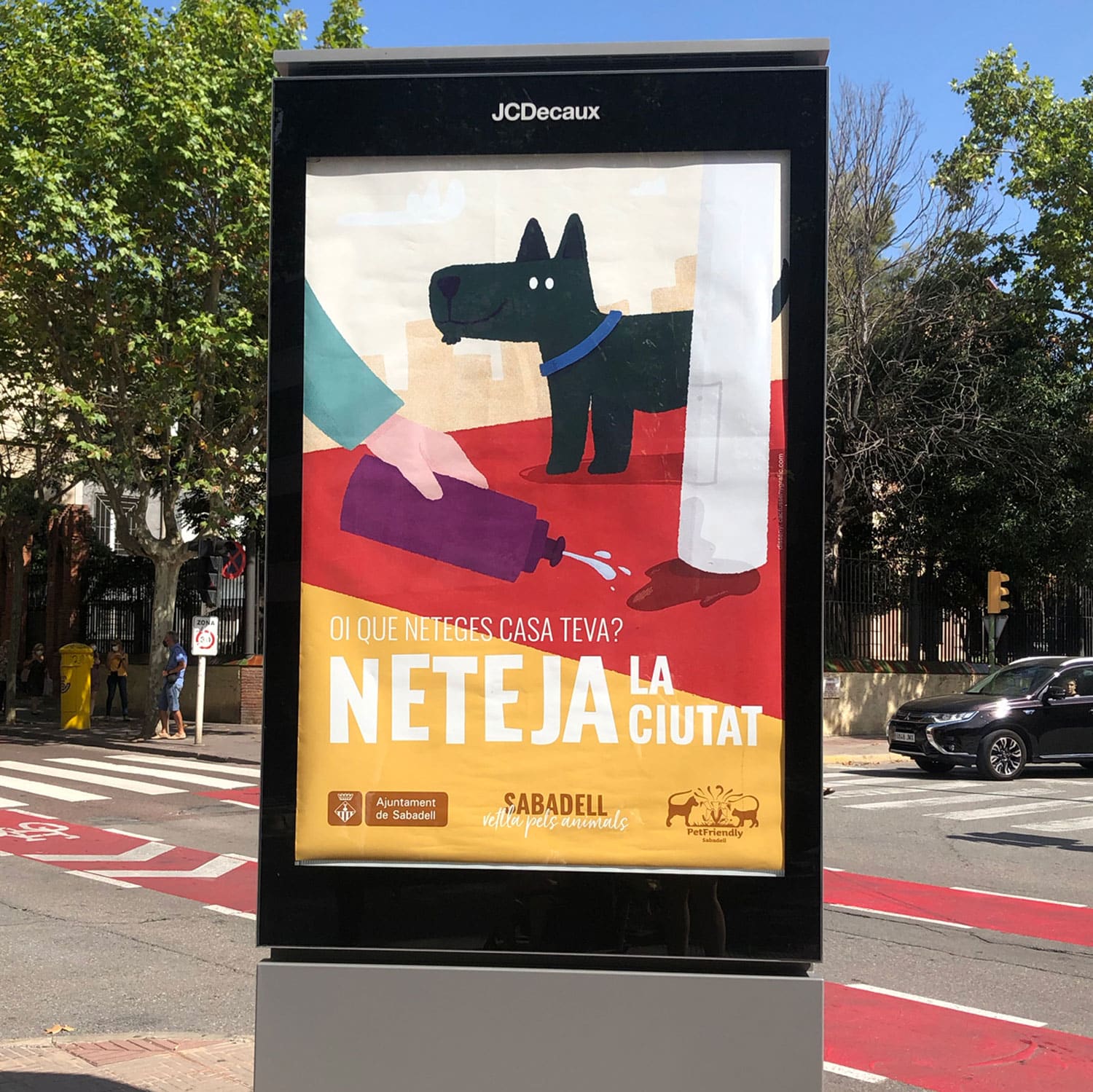 A colorful poster encouraging cleanliness in the city, featuring a dog and a hand with a spray bottle.