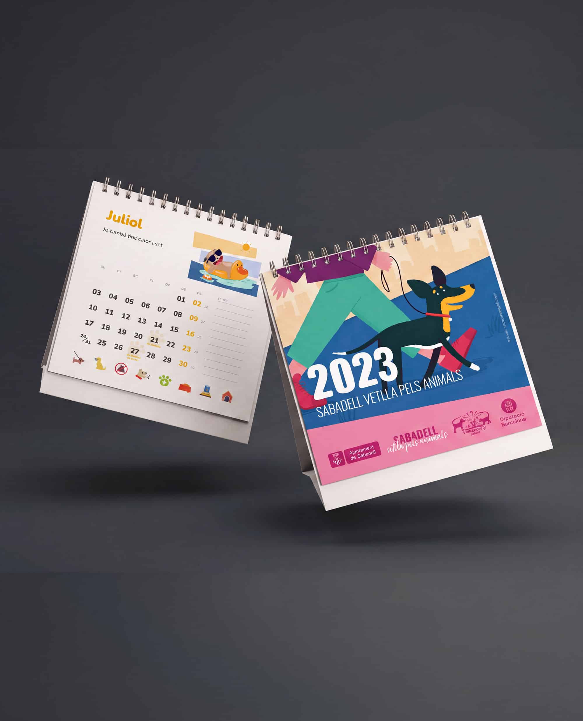 A 2023 calendar featuring illustrations and a dog theme, presented in a dynamic angled display.