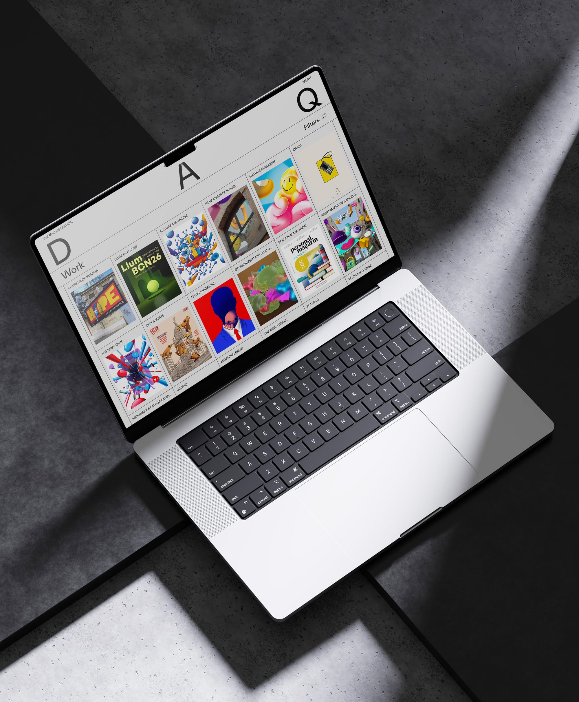 A laptop displaying a colorful portfolio interface on a textured surface.